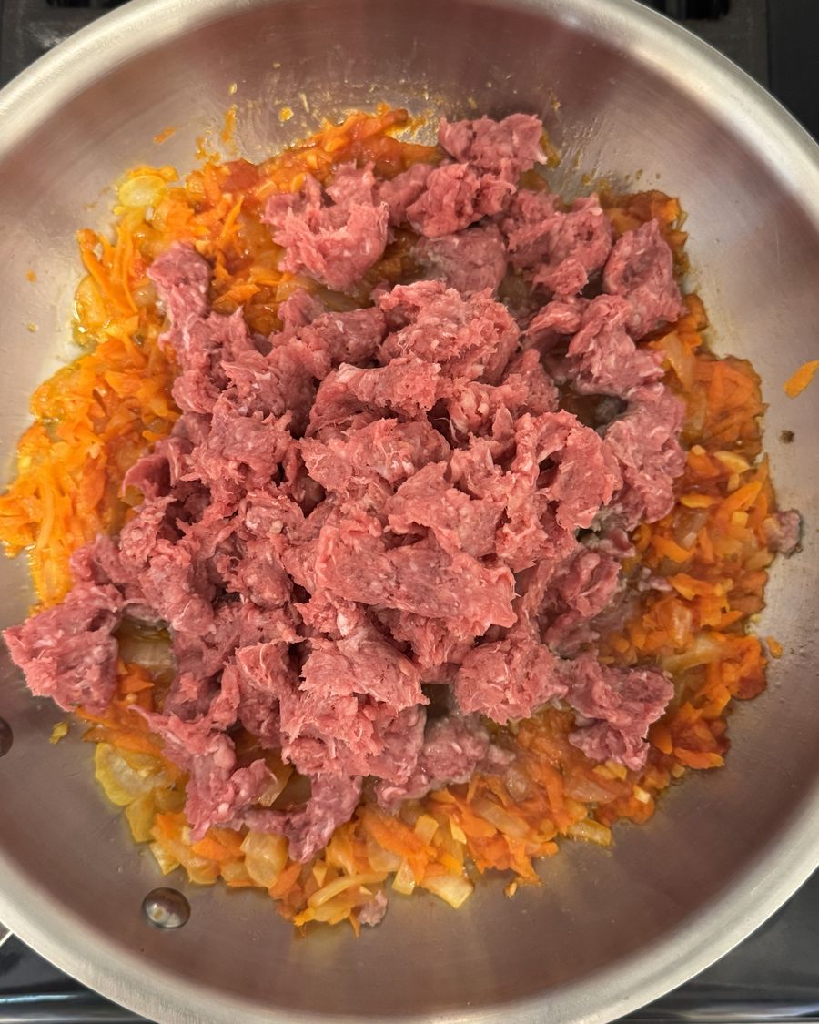 Ground beef added to pan