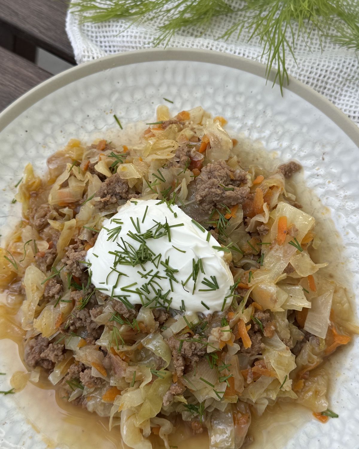 Stew served in bowls with Greek yogurt and dill